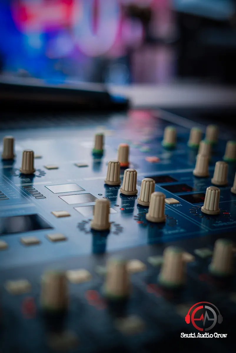 Close-up of mixing console controls before an event