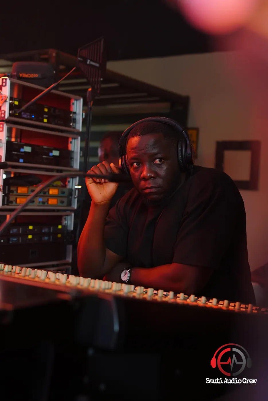 Sauti engineer monitoring the mix on headphones
