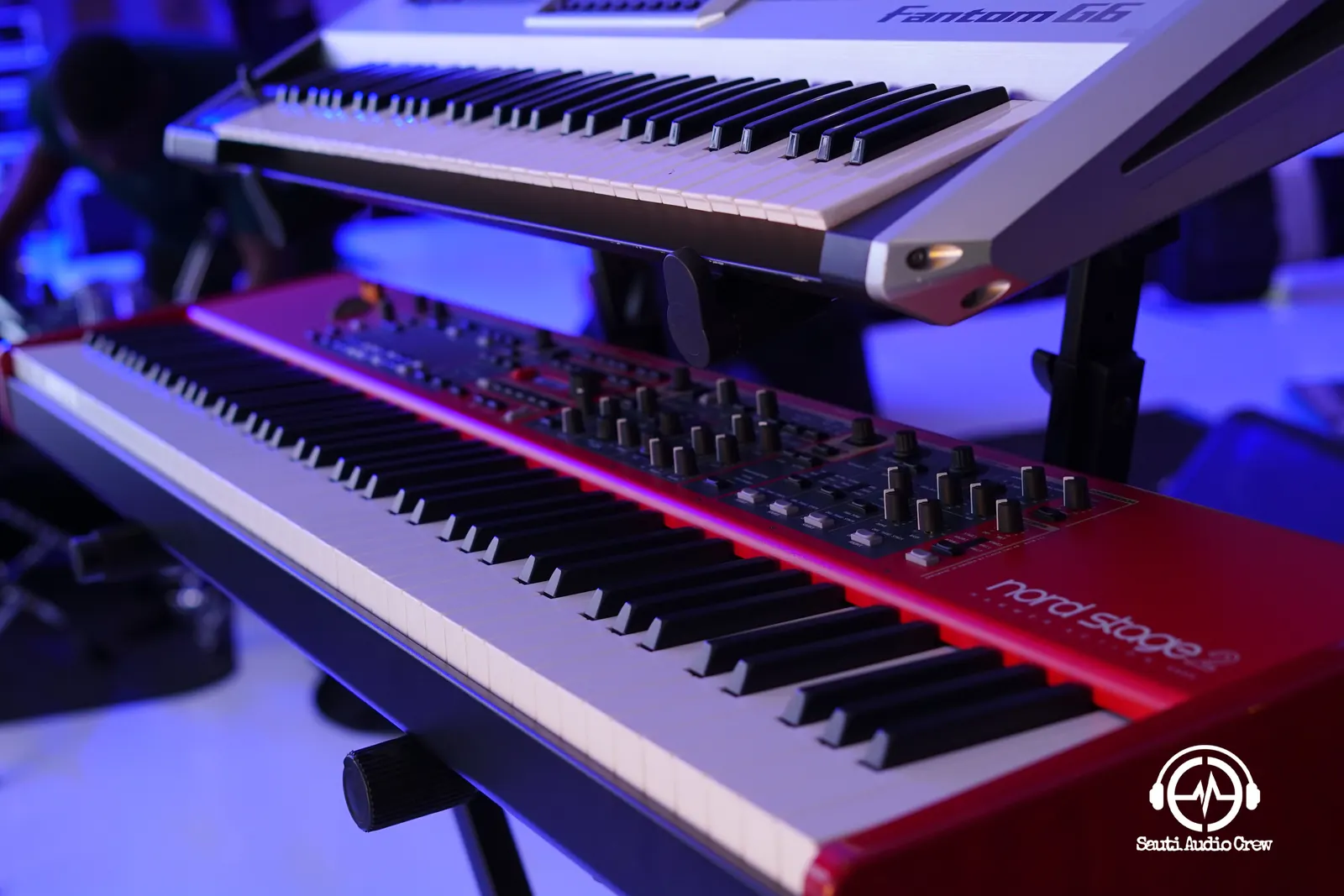 Stacked stage keyboards ready for a performance