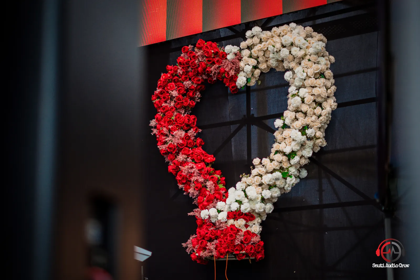 Red and white floral heart on a celebration stage